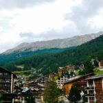 bergkristall oberstaufen - A charming Swiss town with wooden chalets amidst lush forested mountains,