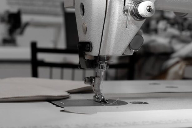 bernina - Closeup of an industrial sewing machine in a textile factory, focused on needle and fabric