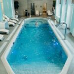 mediterana - Bright indoor spa pool with lounge chairs and calm atmosphere, ideal for relaxation.